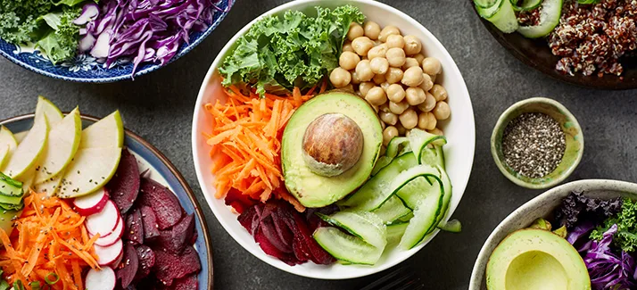 Colourful vegetable bowls with chickpeas and avocado