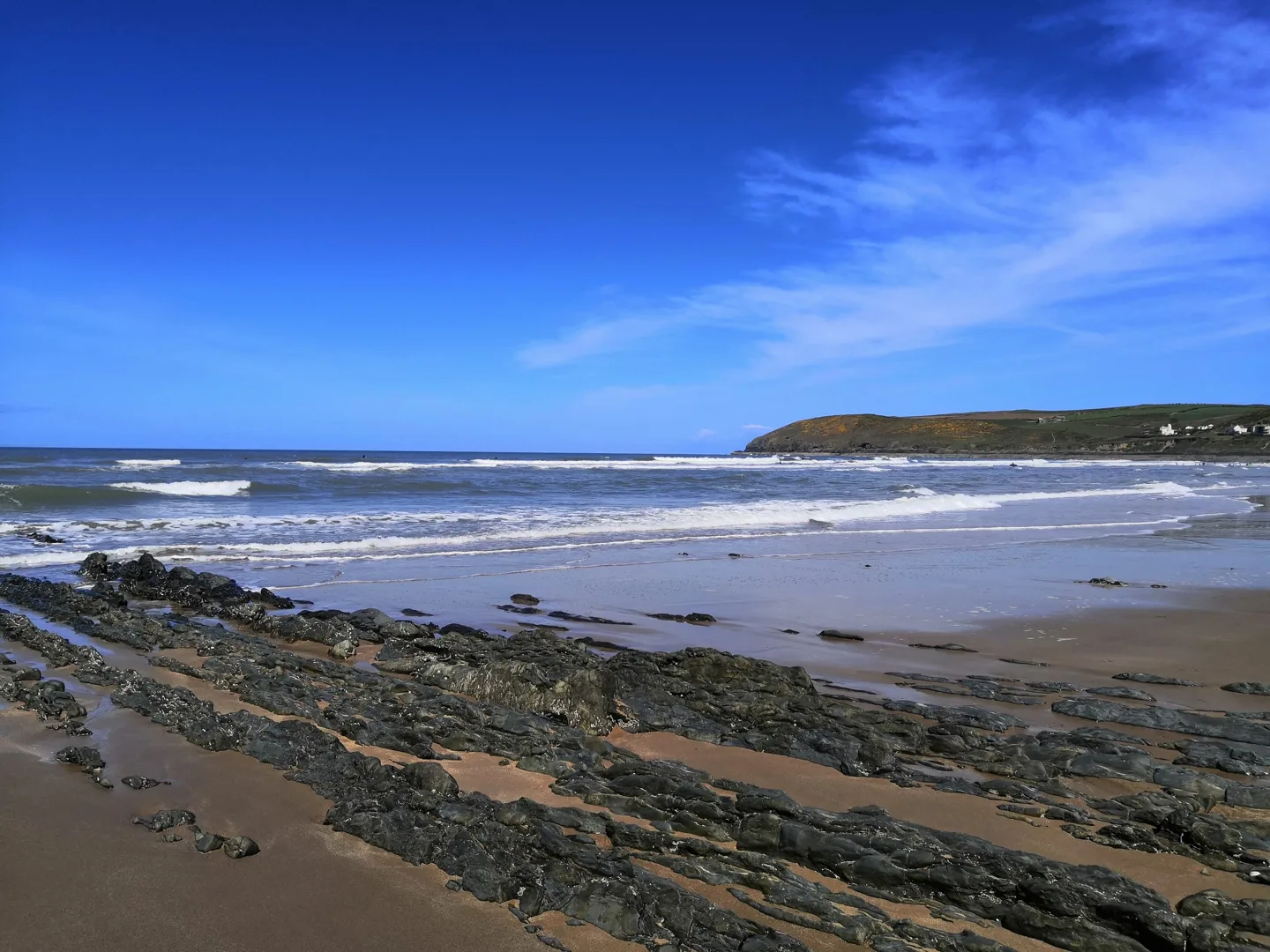 Rock formations and surf on Croyde Beach