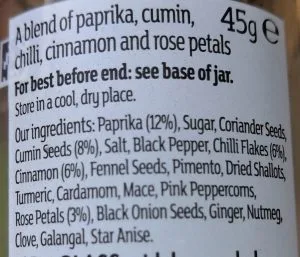 Ras el hanout spice jar showing its ingredient label